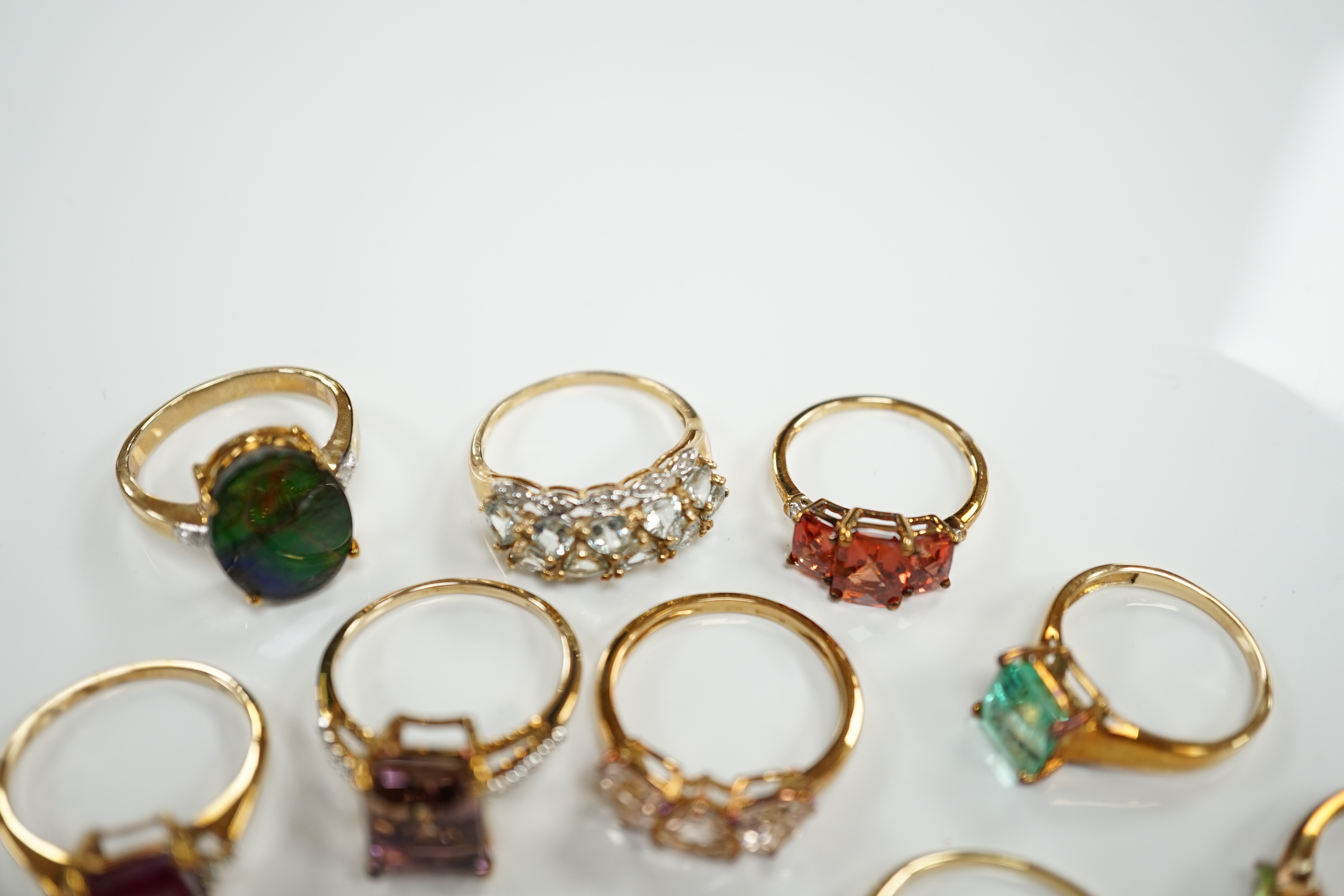 Thirteen assorted modern 9ct gold of 9k and gem set dress rings and a 9ct gold and gem set pendant, gross weight 40.2 grams, together with an 18ct gold, gem and diamond chip set target pendant and an 18ct gold and gem se